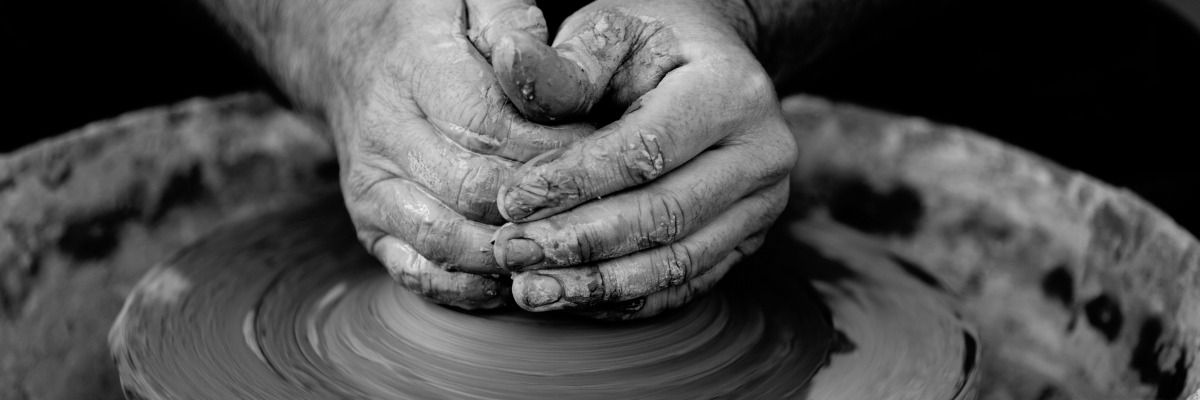 hands molding clay_compressed